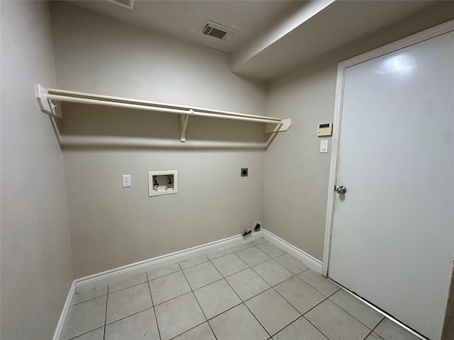 12807 Stratford Heights Dr, Sugar Land, TX 77498 - washroom with hookup for a washing machine, electric dryer hookup, and light tile patterned floors
