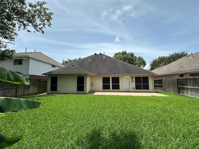 12807 Stratford Heights Dr, Sugar Land, TX 77498 - rear view of house with a patio area, a fenced backyard, and roof with shingles