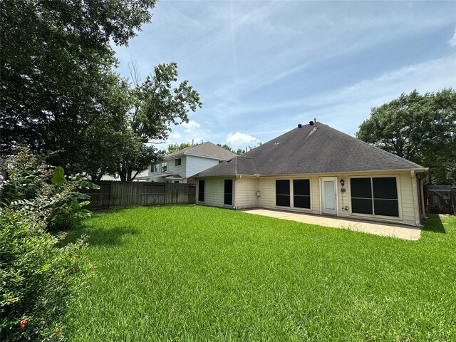 12807 Stratford Heights Dr, Sugar Land, TX 77498 - back of property featuring a patio area and roof with shingles