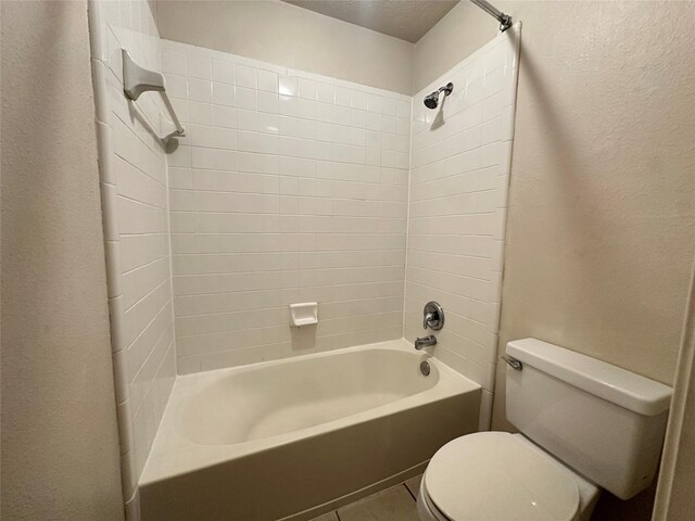 12807 Stratford Heights Dr, Sugar Land, TX 77498 - full bath featuring tub / shower combination, a textured wall, and tile patterned floors