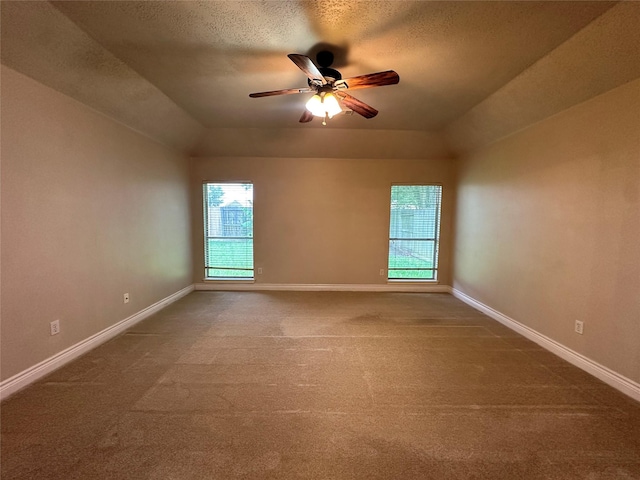 12807 Stratford Heights Dr, Sugar Land, TX 77498 - empty room with carpet, a ceiling fan, a textured ceiling, and vaulted ceiling
