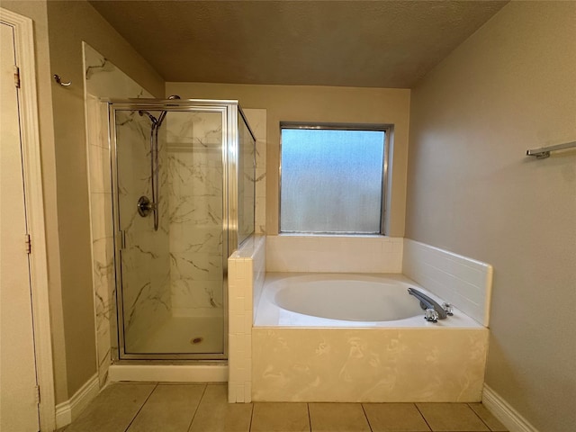 12807 Stratford Heights Dr, Sugar Land, TX 77498 - bathroom with tile patterned flooring, a marble finish shower, and a bath