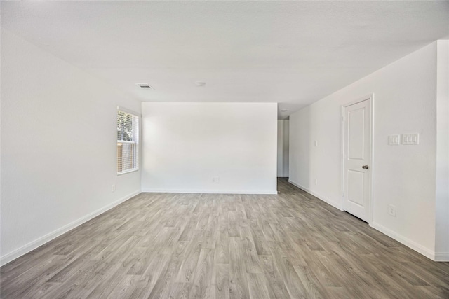 16515 Jasmine Marie Pl, Conroe, TX 77306 - unfurnished room with wood finished floors and baseboards