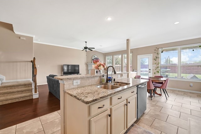 19443 Alton Springs Dr, Cypress, TX 77433 - kitchen with open floor plan, stainless steel dishwasher, ceiling fan, a center island with sink, and crown molding