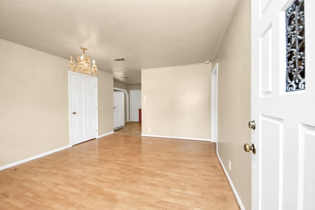 9417 Fairland Dr, Houston, TX 77051 - empty room featuring light wood-style flooring and a chandelier