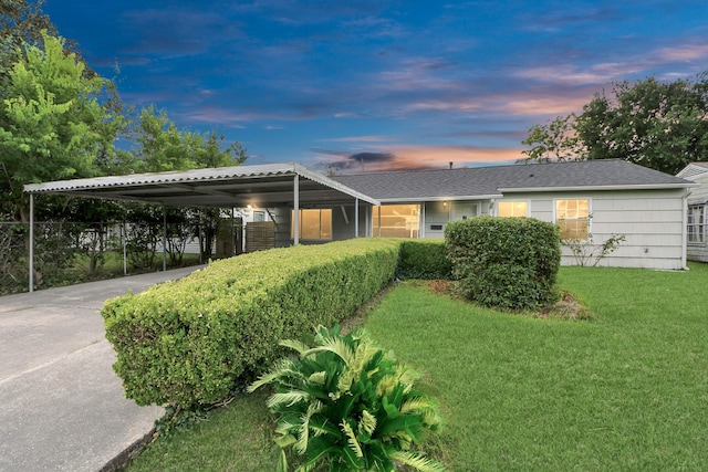 9417 Fairland Dr, Houston, TX 77051 - view of front facade with a front lawn, driveway, and an attached carport
