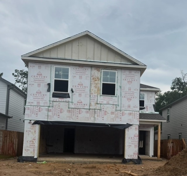 16922 Needlepoint Dr, Conroe, TX 77302 - view of front of property with board and batten siding and driveway