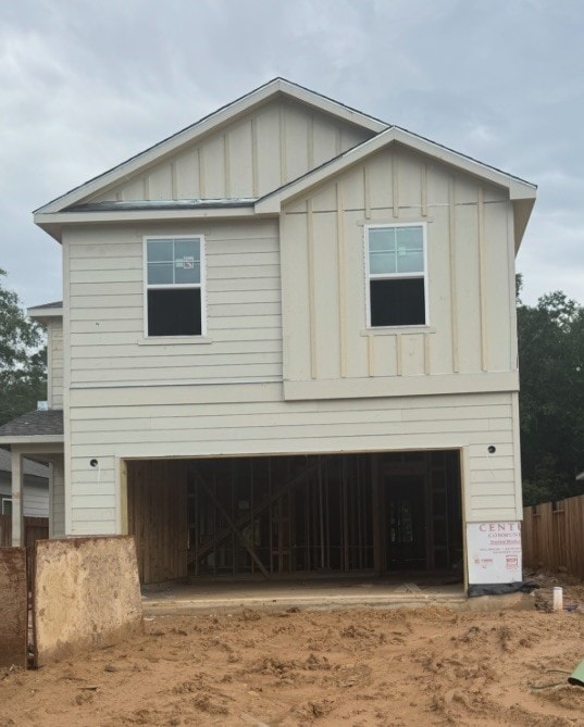 16906 Needlepoint Dr, Conroe, TX 77302 - view of front of property with board and batten siding and an attached garage