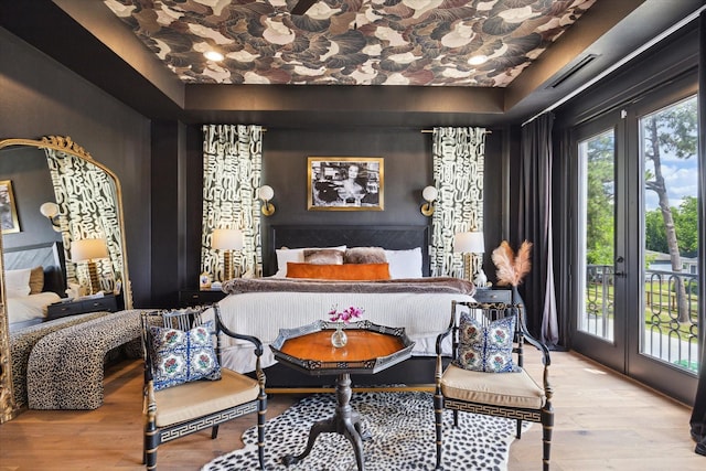 619 W 26th St, Houston, TX 77008 - bedroom with access to exterior, wood finished floors, and french doors