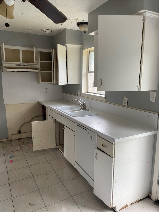 814 Deercrest St, Channelview, TX 77530 - kitchen with white dishwasher, light countertops, white cabinetry, light tile patterned floors, and a textured ceiling