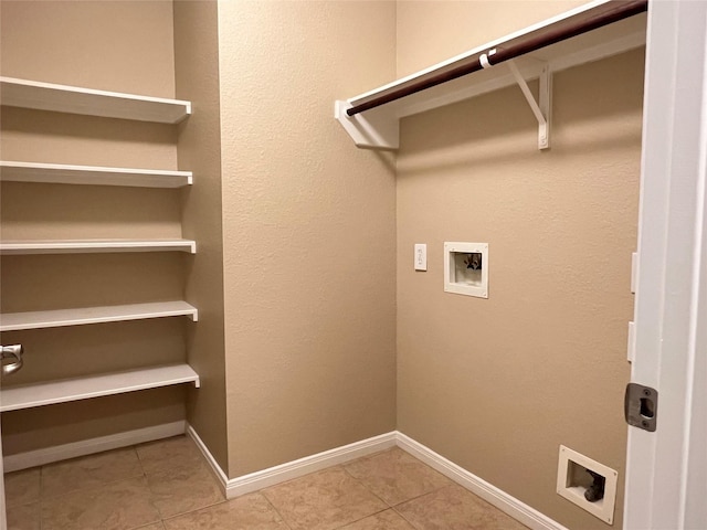 9515 Lower Ridgeway, Houston, TX 77075 - laundry room featuring hookup for a washing machine and light tile patterned flooring