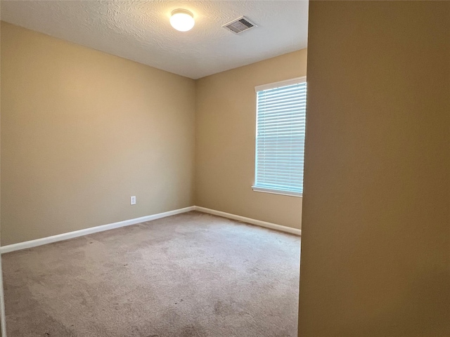 9515 Lower Ridgeway, Houston, TX 77075 - empty room featuring carpet and a textured ceiling