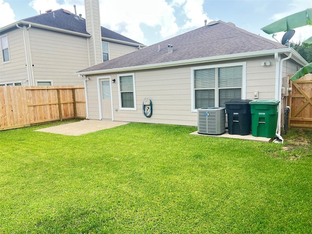 9515 Lower Ridgeway, Houston, TX 77075 - rear view of house featuring roof with shingles, a fenced backyard, and a gate