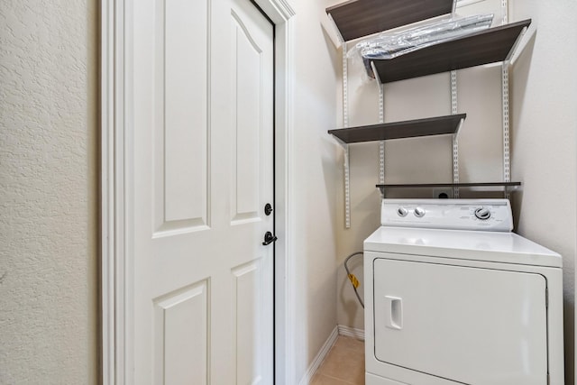 10903 Paterno Dr, Houston, TX 77064 - laundry room with washer / clothes dryer and light tile patterned flooring