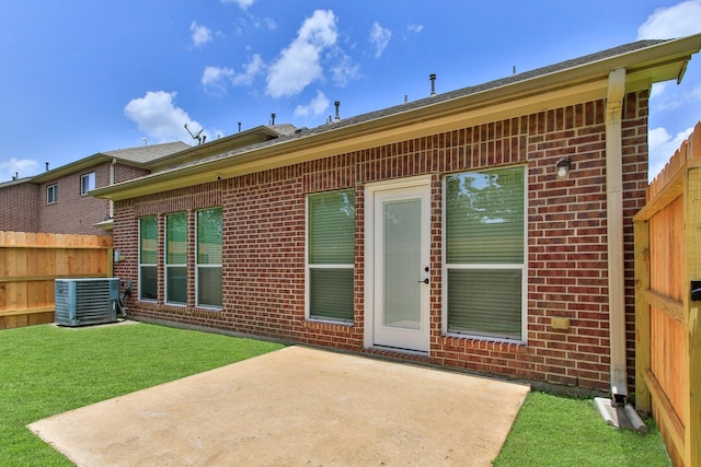 10903 Paterno Dr, Houston, TX 77064 - back of property featuring brick siding and a patio area
