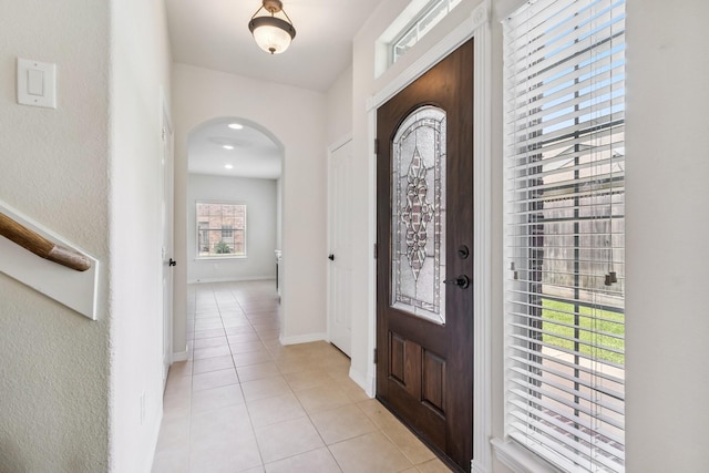 10903 Paterno Dr, Houston, TX 77064 - foyer entrance featuring arched walkways and light tile patterned floors