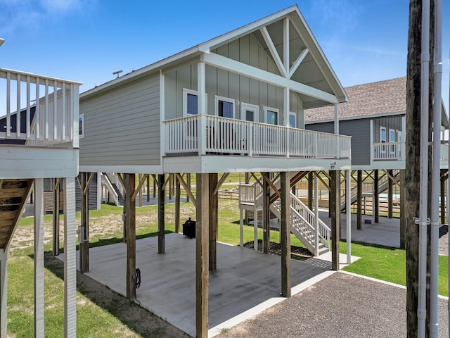 1032 Sunset Cir W, Crystal Beach, TX 77650 - view of playground with stairway, a patio, and a wooden deck