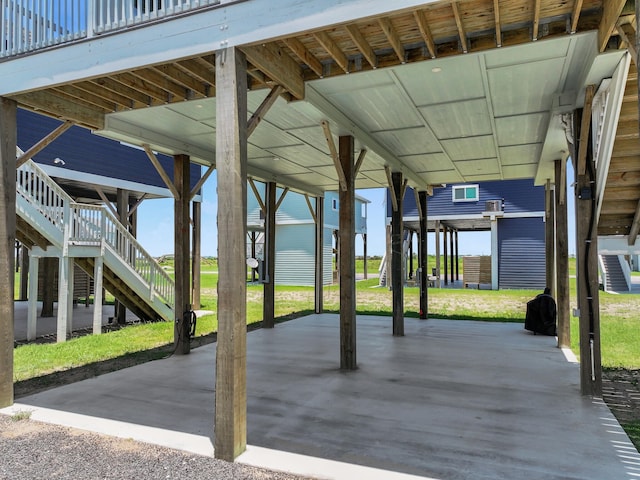 1032 Sunset Cir W, Crystal Beach, TX 77650 - view of patio with stairs and a carport