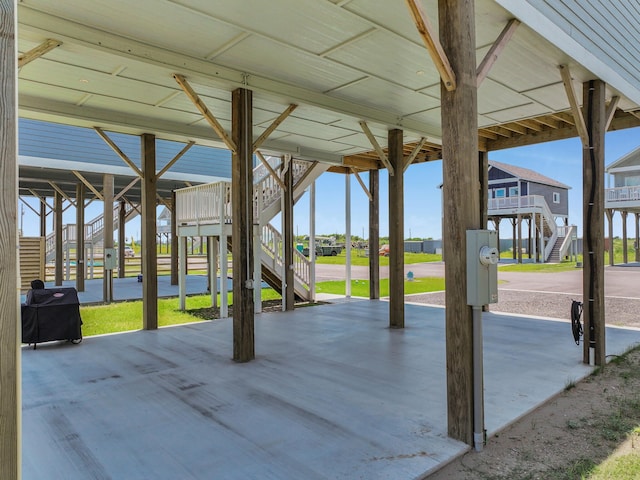 1032 Sunset Cir W, Crystal Beach, TX 77650 - view of patio with stairs and a grill