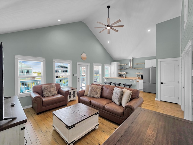 1032 Sunset Cir W, Crystal Beach, TX 77650 - living area with high vaulted ceiling, a ceiling fan, light wood finished floors, and recessed lighting