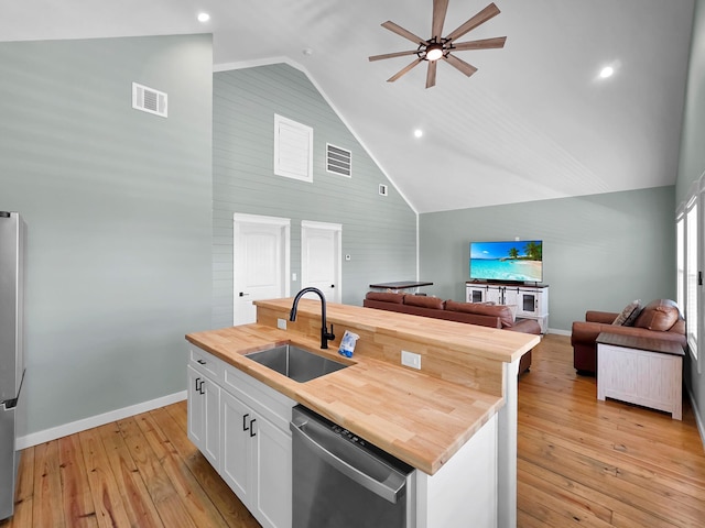 1032 Sunset Cir W, Crystal Beach, TX 77650 - kitchen featuring stainless steel appliances, butcher block counters, a ceiling fan, open floor plan, and high vaulted ceiling