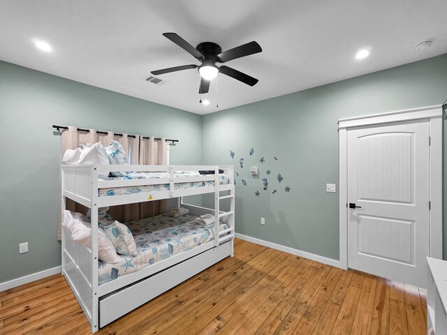 1032 Sunset Cir W, Crystal Beach, TX 77650 - bedroom featuring wood finished floors, recessed lighting, and ceiling fan