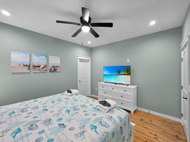 1032 Sunset Cir W, Crystal Beach, TX 77650 - bedroom with light wood-style flooring, recessed lighting, and ceiling fan