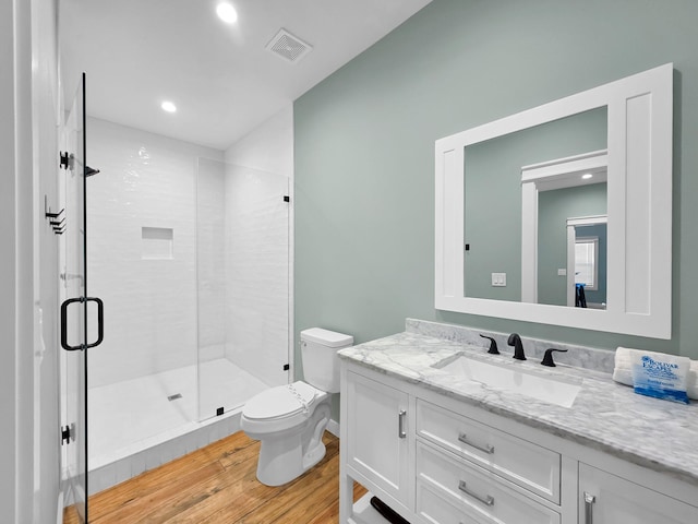 1032 Sunset Cir W, Crystal Beach, TX 77650 - bathroom with wood finished floors, vanity, a shower stall, and recessed lighting