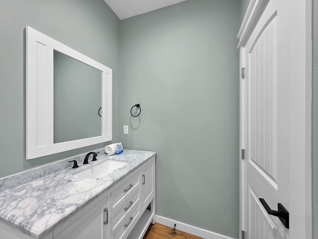 1032 Sunset Cir W, Crystal Beach, TX 77650 - bathroom with vanity and wood finished floors