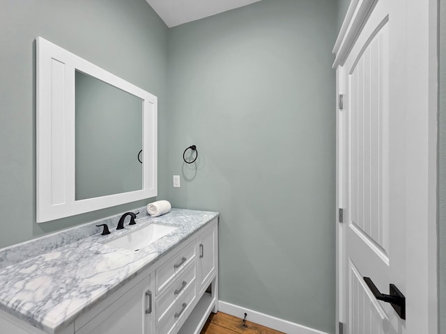 1032 Sunset Cir W, Crystal Beach, TX 77650 - bathroom with vanity and wood finished floors
