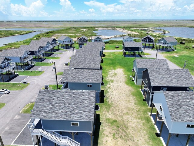 1032 Sunset Cir W, Crystal Beach, TX 77650 - aerial perspective of suburban area with a large body of water