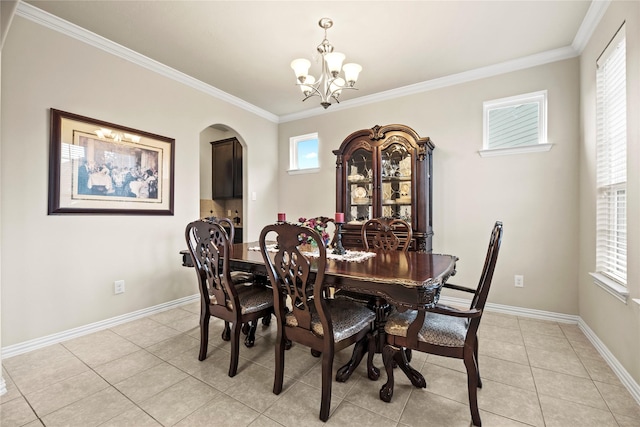 1115 Tydeman Ct, Katy, TX 77494 - dining room with a chandelier, arched walkways, light tile patterned floors, and ornamental molding