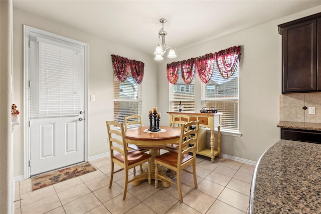 1115 Tydeman Ct, Katy, TX 77494 - dining space featuring light tile patterned flooring and a chandelier