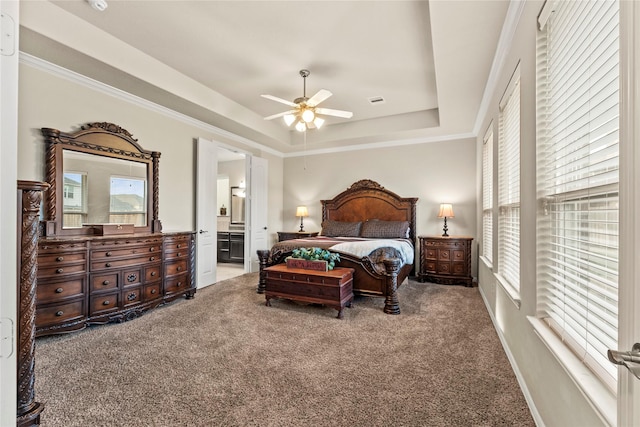 1115 Tydeman Ct, Katy, TX 77494 - carpeted bedroom with a tray ceiling, ensuite bathroom, and a ceiling fan