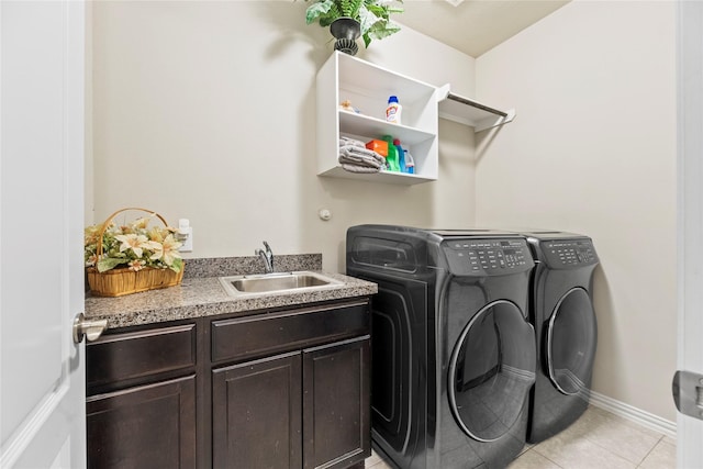 1115 Tydeman Ct, Katy, TX 77494 - laundry area featuring washing machine and dryer, light tile patterned floors, and cabinet space