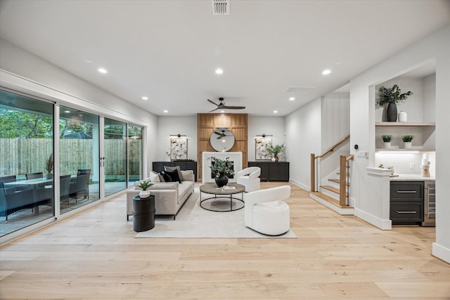 608 E 25th St, Houston, TX 77008 - living area with stairs, light wood-type flooring, recessed lighting, a ceiling fan, and wine cooler