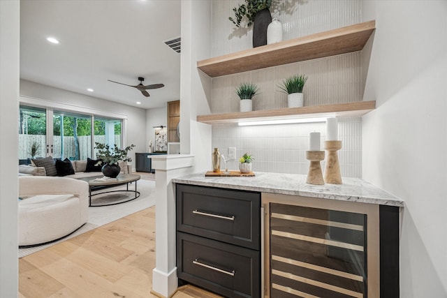 608 E 25th St, Houston, TX 77008 - indoor dry bar featuring beverage cooler, backsplash, light wood-style floors, a ceiling fan, and recessed lighting