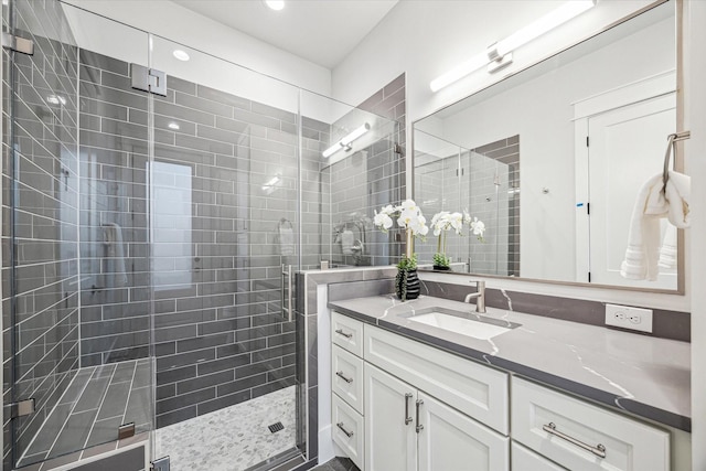 608 E 25th St, Houston, TX 77008 - full bathroom featuring vanity, a shower stall, and recessed lighting