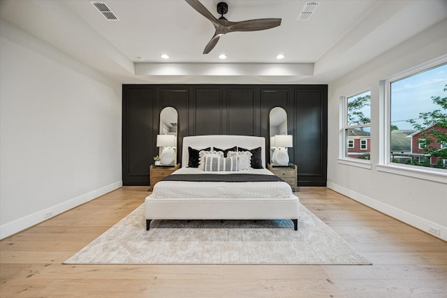 608 E 25th St, Houston, TX 77008 - bedroom with a raised ceiling, light wood-type flooring, recessed lighting, and a ceiling fan