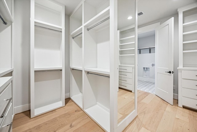 608 E 25th St, Houston, TX 77008 - walk in closet with light wood-style floors