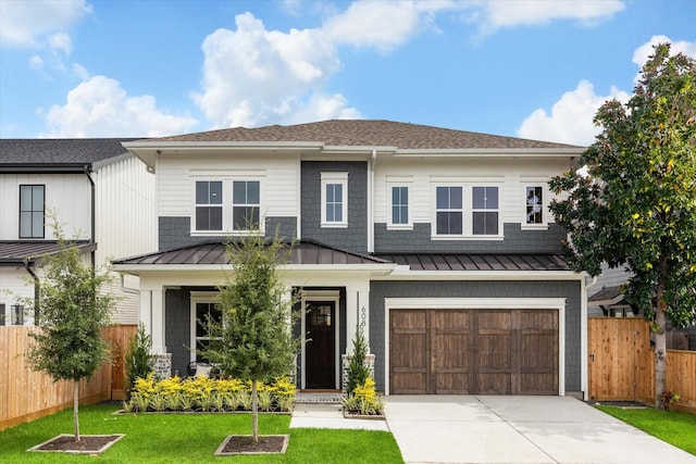 608 E 25th St, Houston, TX 77008 - view of front of house with a standing seam roof, concrete driveway, an attached garage, roof with shingles, and a metal roof