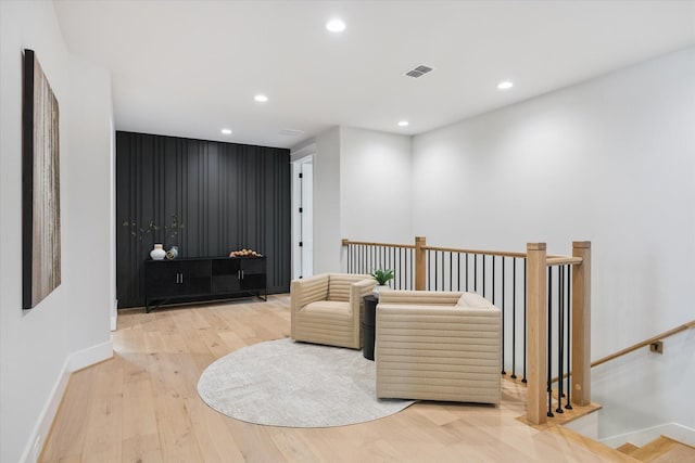 608 E 25th St, Houston, TX 77008 - sitting room with wood finished floors, recessed lighting, and an upstairs landing