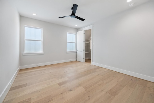 608 E 25th St, Houston, TX 77008 - unfurnished bedroom with light wood-type flooring, recessed lighting, a walk in closet, and ceiling fan