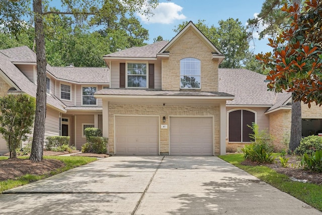 87 E Greenhill Terrace Pl, The Woodlands, TX 77382 - traditional-style home with stone siding, roof with shingles, driveway, and a garage