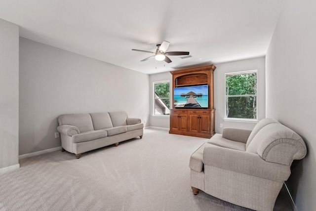 87 E Greenhill Terrace Pl, The Woodlands, TX 77382 - living room featuring ceiling fan and light colored carpet