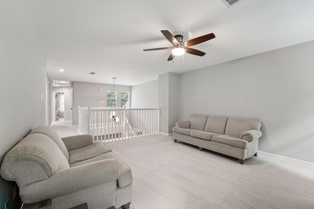 87 E Greenhill Terrace Pl, The Woodlands, TX 77382 - living room with ceiling fan, carpet, and attic access