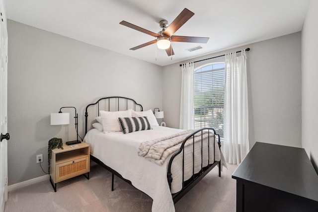 87 E Greenhill Terrace Pl, The Woodlands, TX 77382 - bedroom with light colored carpet and ceiling fan
