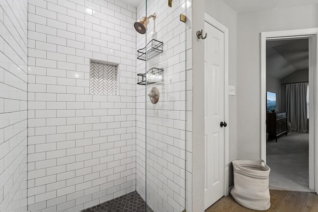 87 E Greenhill Terrace Pl, The Woodlands, TX 77382 - full bathroom with wood finished floors and a tile shower