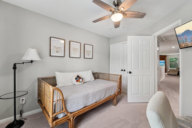 87 E Greenhill Terrace Pl, The Woodlands, TX 77382 - bedroom with light colored carpet, attic access, a closet, and ceiling fan