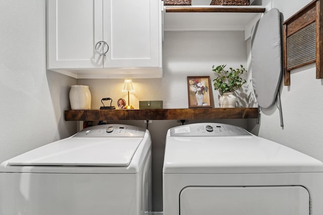 87 E Greenhill Terrace Pl, The Woodlands, TX 77382 - laundry room with cabinet space, separate washer and dryer, and a textured wall